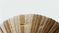 Wooden texture samples arranged in fan pattern showing natural wood grain variations and color tones for interior design and material selection projects.