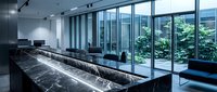 Modern corporate boardroom with marble conference table and floor-to-ceiling windows overlooking urban courtyard for business meetings and presentations.