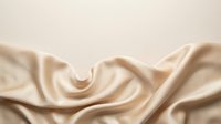 Luxurious beige silk fabric with soft folds and waves, creating elegant drapes and flowing textures. Perfect for luxury, fashion, textile, and design projects.