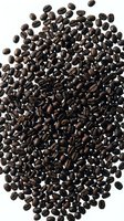 Dark roasted coffee beans scattered on white background, isolated for cafe branding, restaurant menus, beverage advertising and culinary design projects.