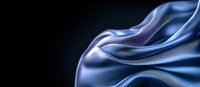 Elegant flowing silk fabric in shades of blue and purple creates dramatic curves and waves against dark background, abstract luxury textile design concept.