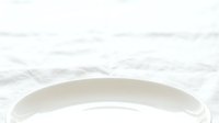 Isolated white ceramic bowl on marble surface, ready for product mockups, tableware design, kitchenware marketing, and commercial use.
