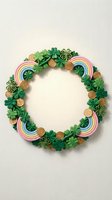 Festive St Patrick's Day wreath with green shamrocks, gold coins and colorful rainbows on neutral background for holiday decorations and seasonal crafts.