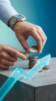 Businessman hands stacking coins with upward arrow showing financial growth and investment success on modern blue background.
