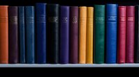 Row of colorful vintage hardcover books arranged on wooden shelf, spines showing in various shades of blue, purple, yellow, green and red, creating academic atmosphere.