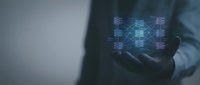 Businessman holding glowing digital network connections in palm showcasing futuristic technology and data visualization for business presentations.