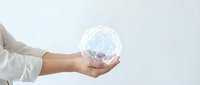 Caucasian male hand in white shirt holding glowing digital globe with network connections, representing global technology, innovation, and worldwide business communication.