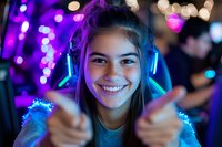 Young woman with glowing blue headphones smiling at nightclub with purple bokeh lights in background, showing thumbs up gesture while wearing sparkly outfit.