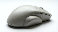 Vintage white computer mouse on a white background, isolated peripheral device for retro technology and computing concepts.