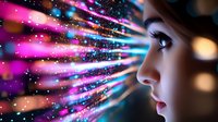 Young woman profile with glowing digital light rays and particles streaming across face in pink and blue colors creating futuristic technology concept effect.