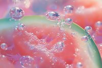 Macro view of water droplets on juicy watermelon surface with vibrant pink and green colors creating dreamy summer atmosphere.