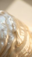 Soft golden blonde hair flowing in warm sunlight with natural movement and shine for beauty and haircare concepts.