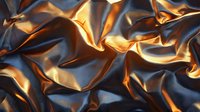 Luxurious metallic fabric with dramatic folds and creases creating abstract pattern of light and shadows in gold and navy blue tones. Elegant textile background.