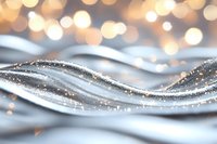 Elegant silver waves with sparkling glitter particles flow against blurred golden bokeh background creating luxurious festive atmosphere for holiday designs.
