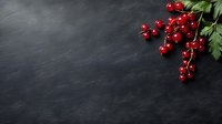 Fresh red currants with green leaves on dark slate background with copy space for culinary and healthy eating concepts.