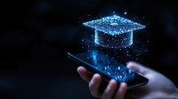 Glowing blue hologram graduation cap floating above smartphone in hand against dark background, representing digital education and e-learning technology.