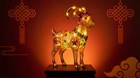 Golden ornate goat figurine with intricate patterns on decorative stand against warm red background with traditional Asian motifs for lunar new year celebrations.