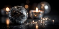 Shimmering disco ball with glowing candles on dark background, creating festive atmosphere for party or celebration event.