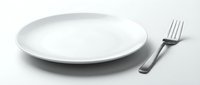 Empty white ceramic plate with silver fork on white background, isolated tableware set for restaurant menu, food styling design.