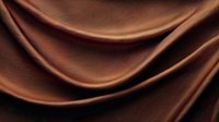 Smooth waves of luxurious brown silk fabric create elegant folds and curves against dark background, showcasing rich texture and flowing movement. For fashion and luxury designs.