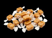 Caramel candies wrapped in clear cellophane isolated on transparent background, ready for clipart, print-on-demand, sublimation, t-shirt design and packaging mockups.