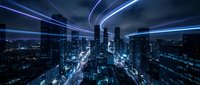 Futuristic smart city skyline with glowing blue light trails and digital network connections over urban landscape at night for technology concepts.