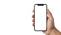 Hand holding modern smartphone with blank white screen isolated on white background for mobile app mockup and digital presentation templates.