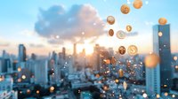 Floating golden dollar coins against blurred urban cityscape at sunset, glowing bokeh lights and modern skyscrapers silhouettes create financial concept background.