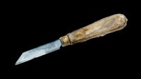 Vintage putty knife with weathered wooden handle and metal blade, isolated on transparent background. Ready for design use on t-shirts, clipart, stickers, and print-on-demand products.