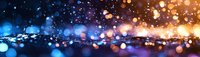 Glowing bokeh lights on dark reflective surface create magical atmosphere with blue and golden sparkles in panoramic composition for festive backgrounds.