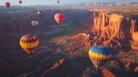 Hot air balloons floating over dramatic red rock canyons and mesas during golden sunrise, creating vibrant contrast between colorful aircraft and rugged desert landscape.