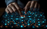 African American hands interacting with glowing blue network visualization on dark background, representing digital transformation and future technology.