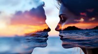 Double exposure silhouettes of young couple facing each other against dramatic ocean sunset background, merging faces with seascape in romantic composition.