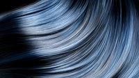Flowing blue-gray hair strands with metallic highlights creating dynamic movement and texture for beauty and fashion concepts.