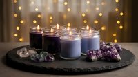 Aromatherapy candles with lavender flowers and crystals on slate board creating spa atmosphere with warm bokeh lights background for relaxation and wellness.