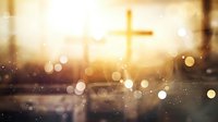 Glowing Christian cross silhouette against golden sunset sky with bokeh lights and lens flare effect creates spiritual atmosphere for religious backgrounds.