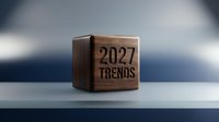 Wooden cube displaying 2027 trends text on modern surface with soft lighting for business forecasting and future planning concepts.