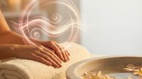 Relaxing spa massage therapy with glowing energy swirls and warm golden light creating peaceful wellness atmosphere for holistic healing treatments.