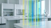 Modern laboratory interior with colorful light beams streaming through clean white workspace showcasing scientific research environment and technology.