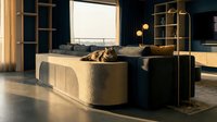 Tabby cat resting on a curved boucle sofa in a luxurious dark blue living room with golden accents and city view.