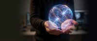 Businessman holding glowing digital network sphere with connected lines representing global connectivity, technology innovation and data visualization concepts.