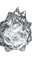 Splashing liquid forms sharp crystalline peaks with bubbles suspended throughout, isolated on white background for design and advertising use.