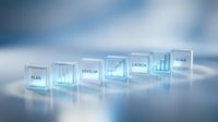 Transparent glass blocks displaying business development stages from plan to scale against soft blue background for corporate presentations and strategy concepts.