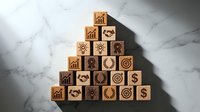 Wooden blocks arranged in pyramid formation with business icons including growth charts, gears, handshakes, targets and dollar signs on marble surface.