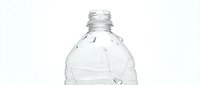 Crumpled clear plastic water bottle isolated on white background, ready for recycling, environmental awareness, and sustainability design projects.