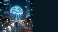 Glowing brain inside lightbulb against blurred city lights at night representing innovation, creativity and intelligent solutions for business technology.