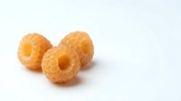 Fresh golden raspberries isolated on white background for healthy eating and organic food concepts.