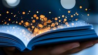Open book with magical glowing sparkles and golden light particles floating above pages against dark background, creating mystical reading atmosphere.