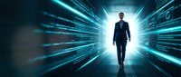 Professional businessman walking through futuristic digital tunnel with glowing blue light streaks and data streams for technology and business concepts.
