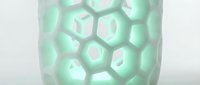Modern mint green hexagonal pattern ceramic vase with geometric honeycomb design for contemporary home decor and interior styling applications.